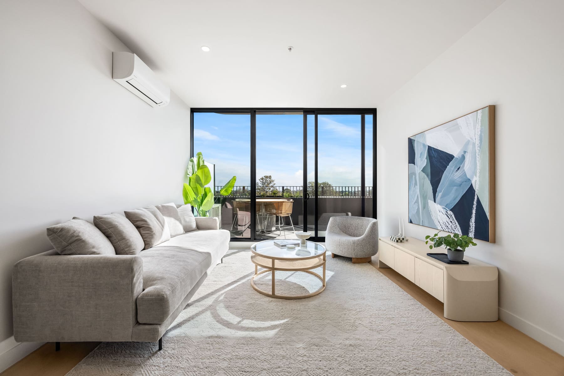 Rosella Murrumbeena apartment kitchen with stone island benchtop and premium appliances